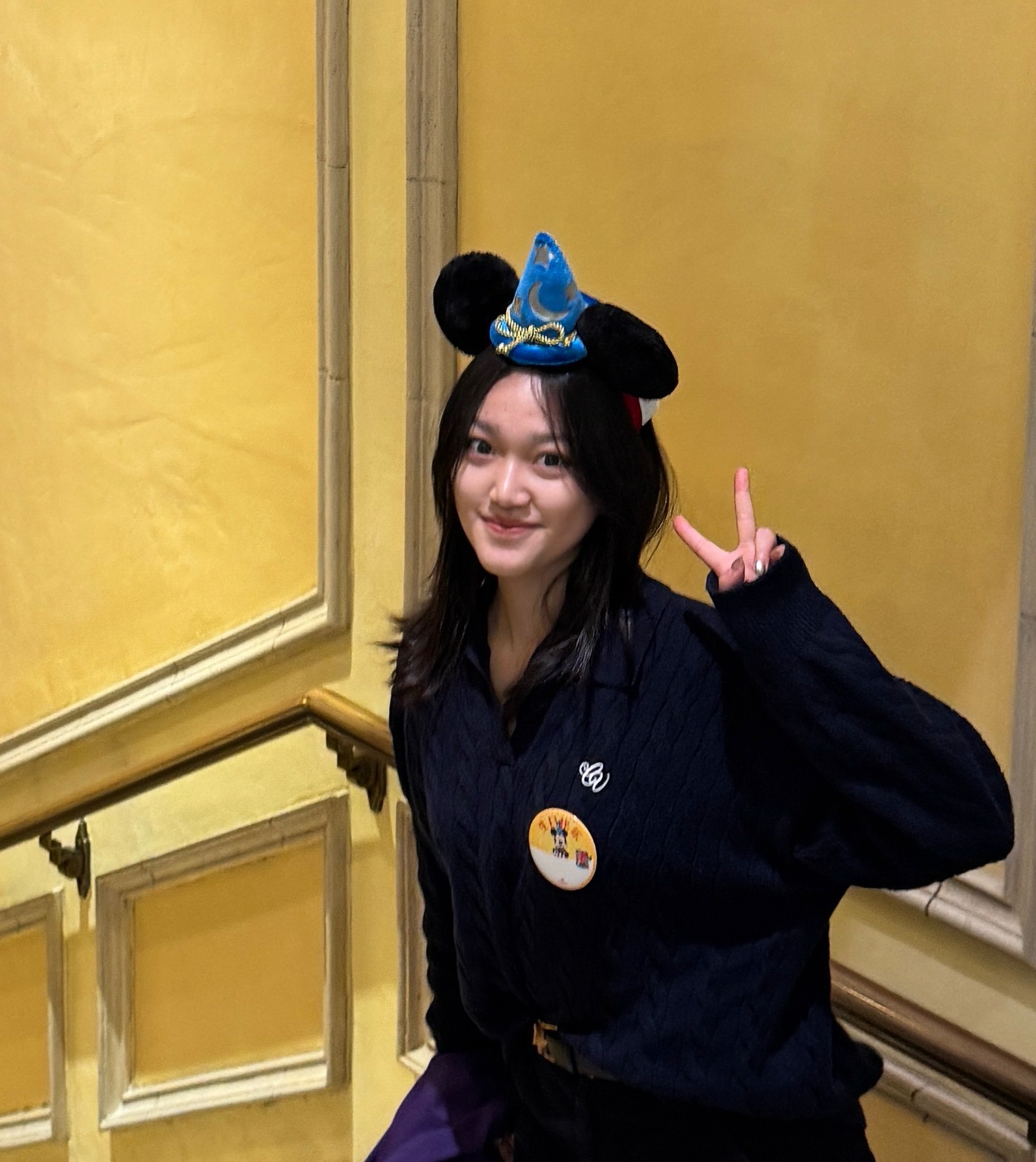 Zimeng Chen wearing a Mickey Mouse sorcerer hat